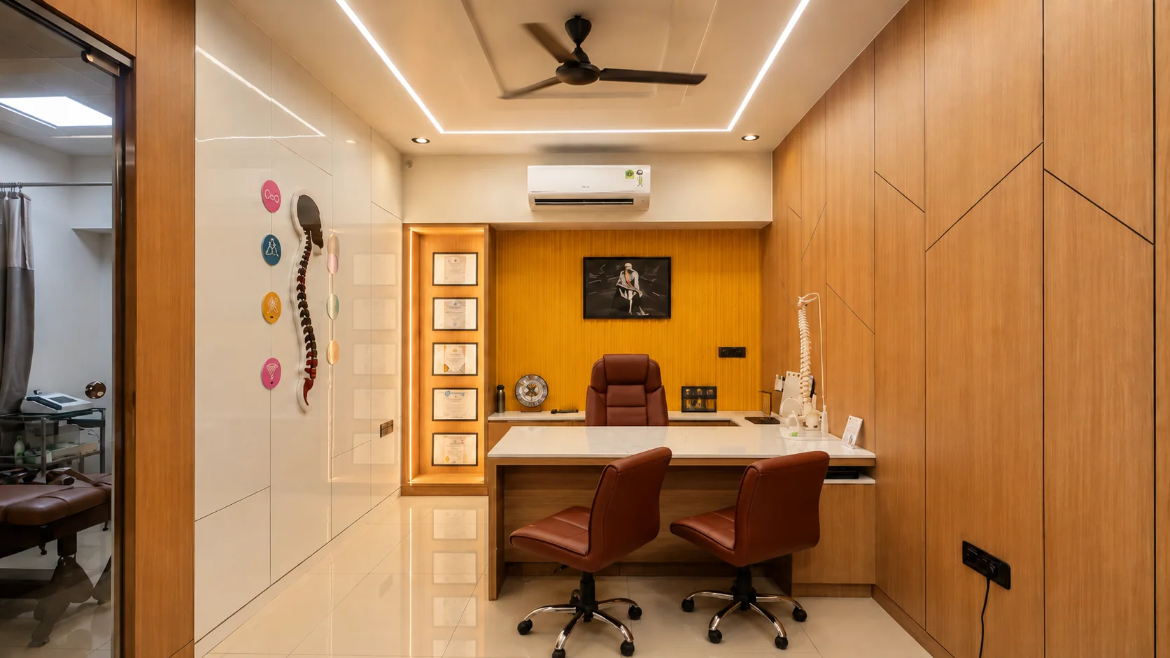 Private consultation room at Sai Om with anatomical spine models