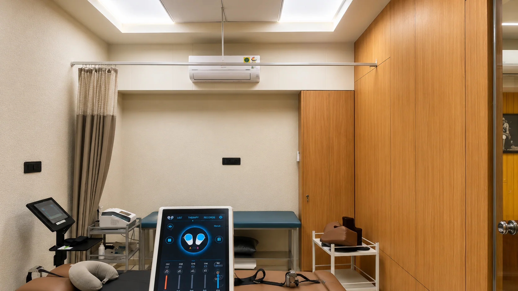 Dedicated treatment room with modern physiotherapy equipment at Sai Om
