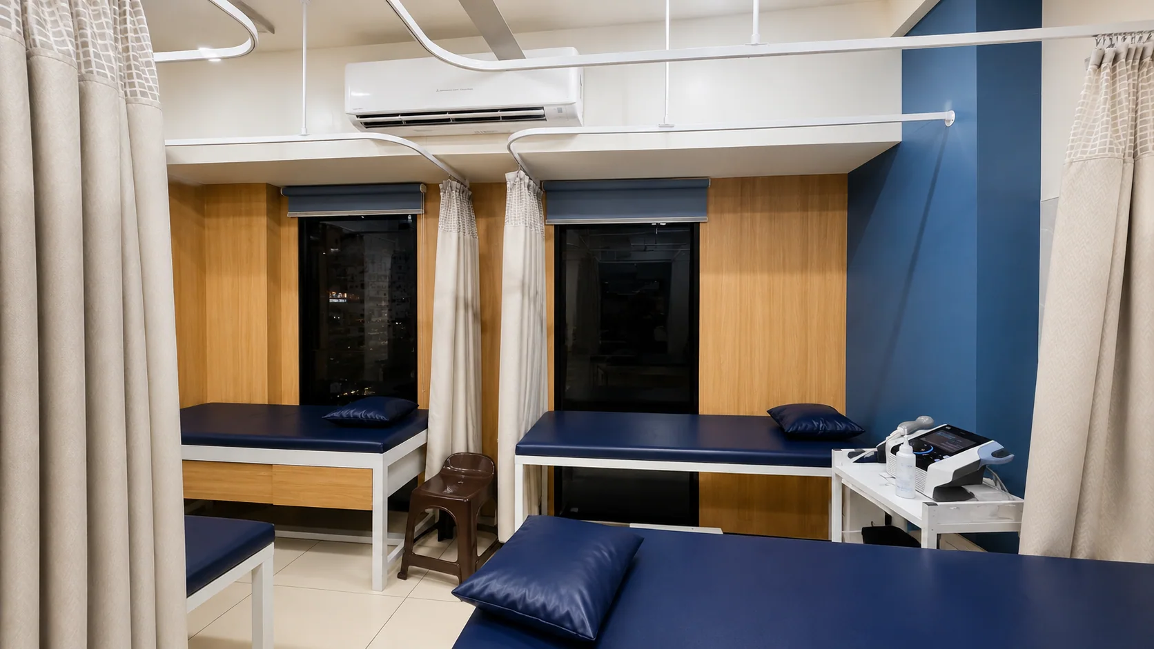 Private curtained therapy bays in the Sai Om physiotherapy centre